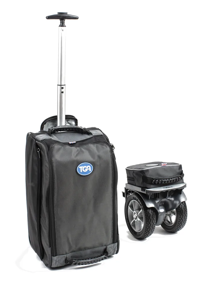 Motor TGA Powerpack junto a su bolsa de transporte con ruedas
